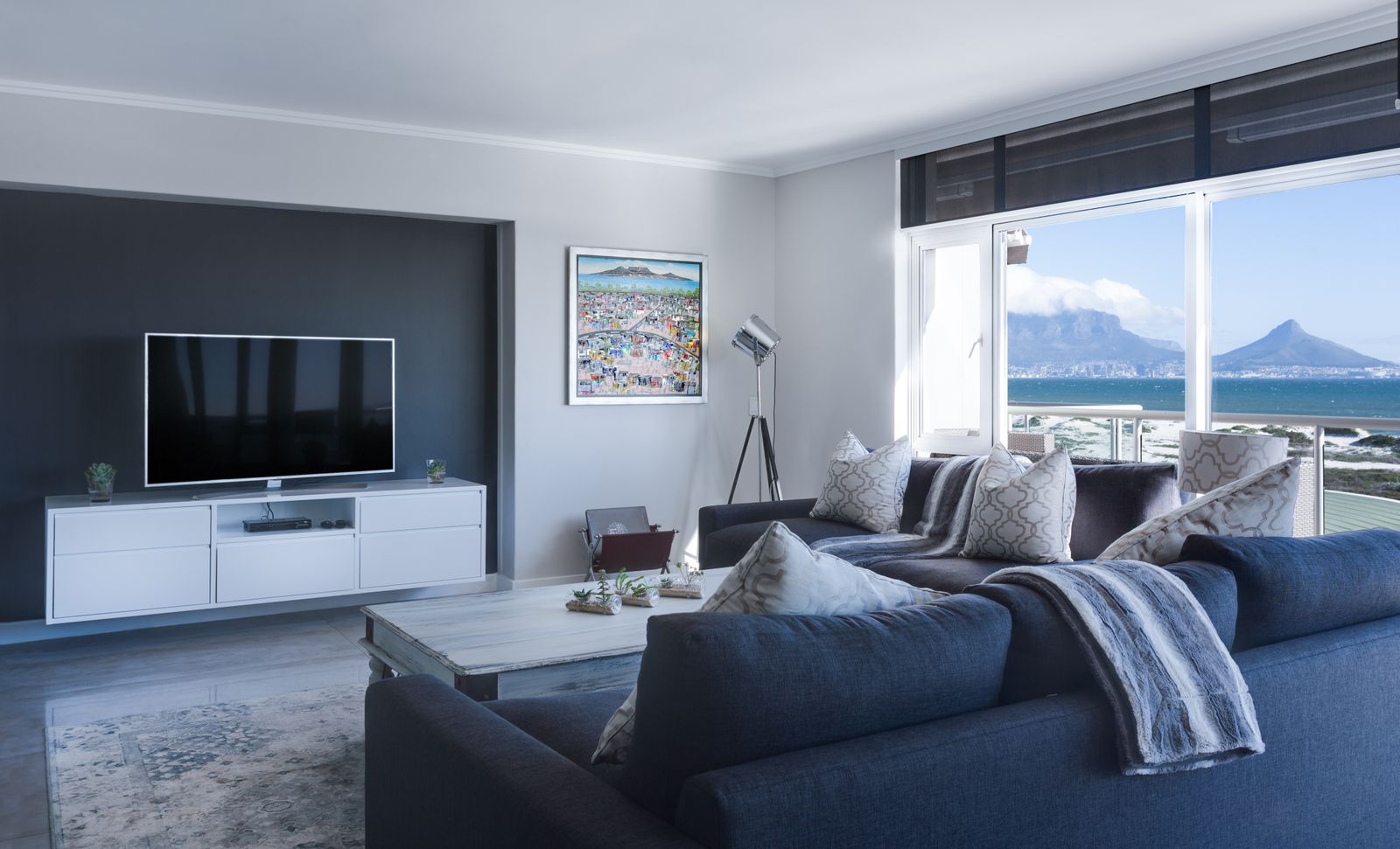 A freshly decorated living room looking out to the coast